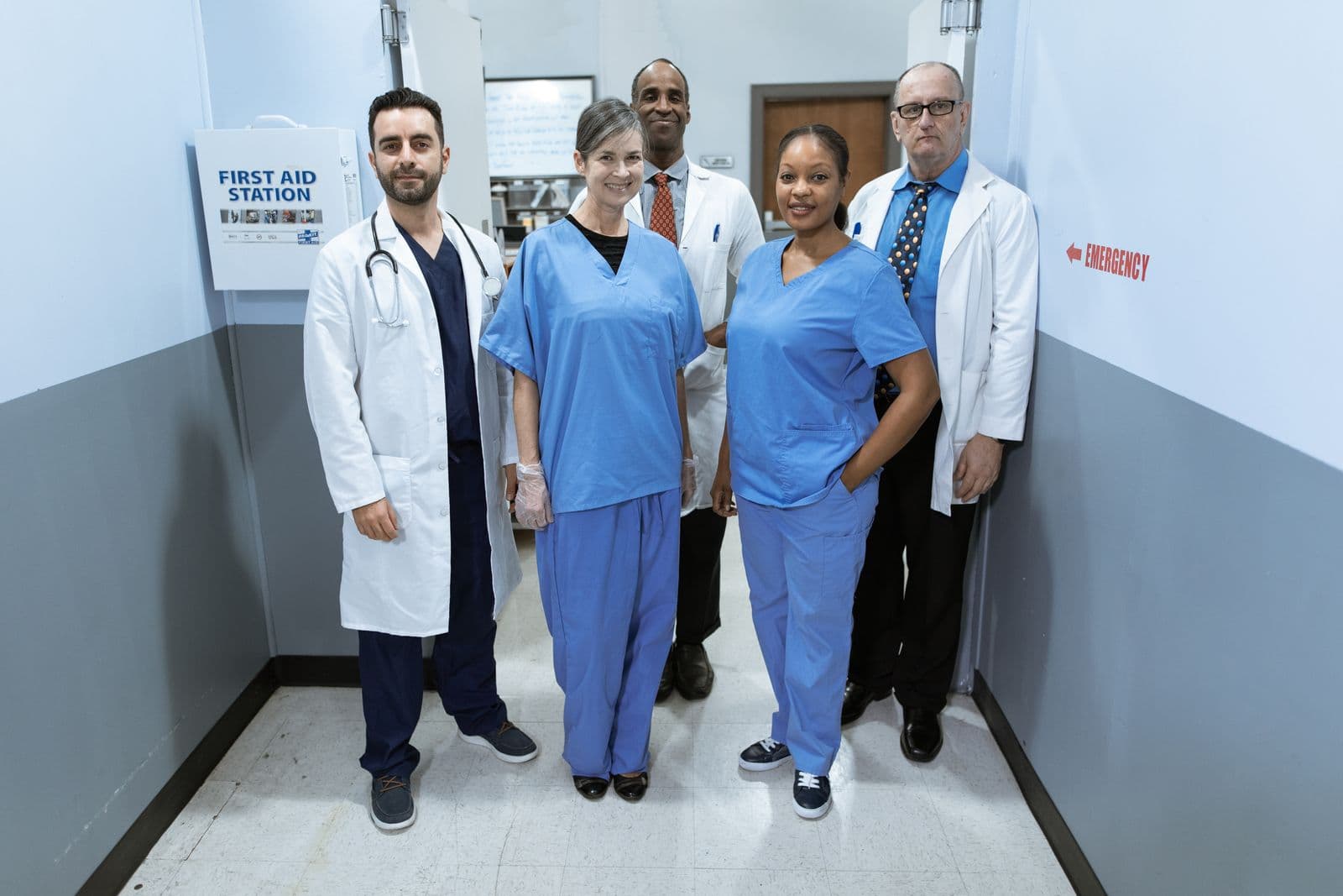 Nurses and doctors standing together in a hospital corridor